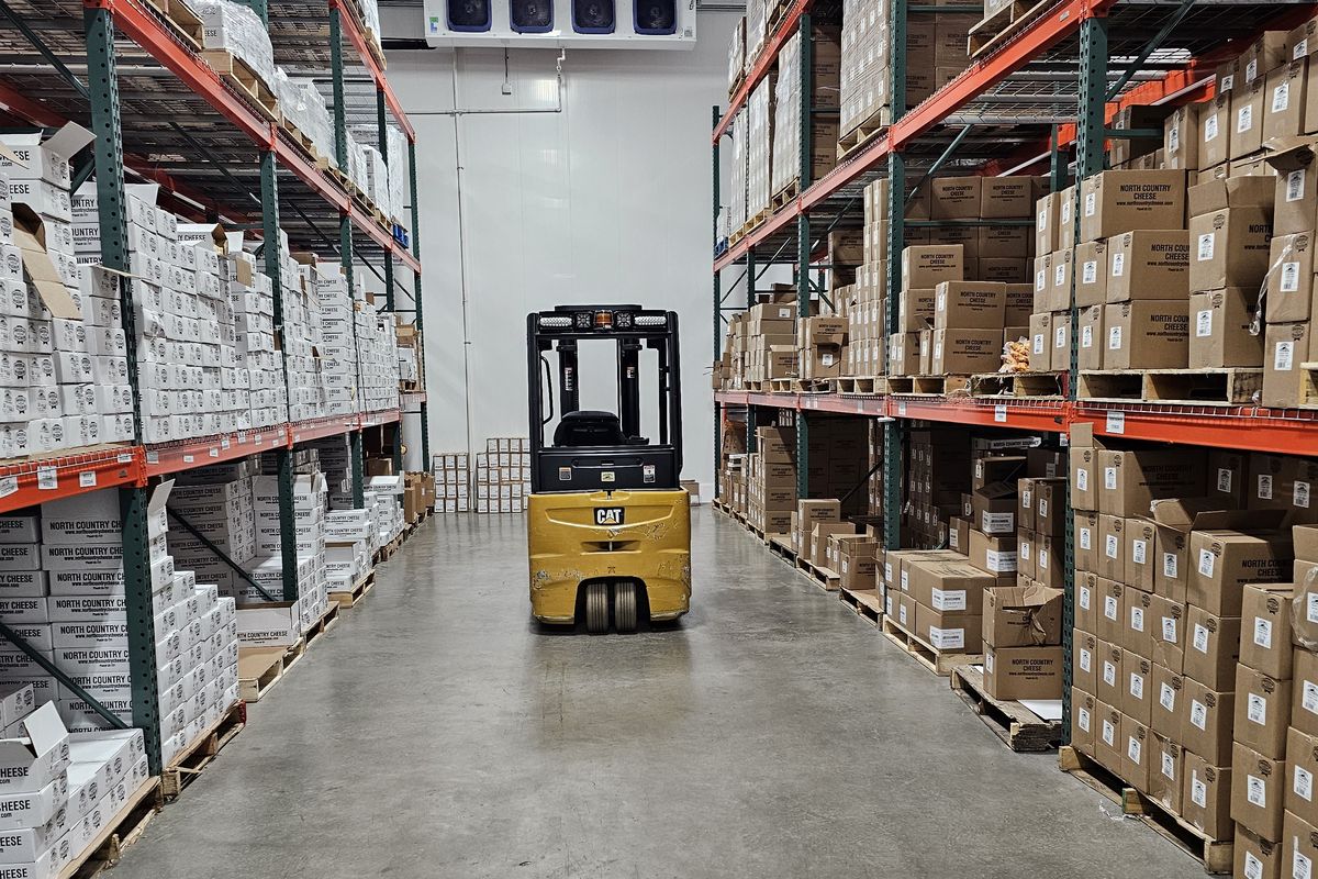 Inside the Wenger Distributing warehouse — climate-controlled racking served by forklift